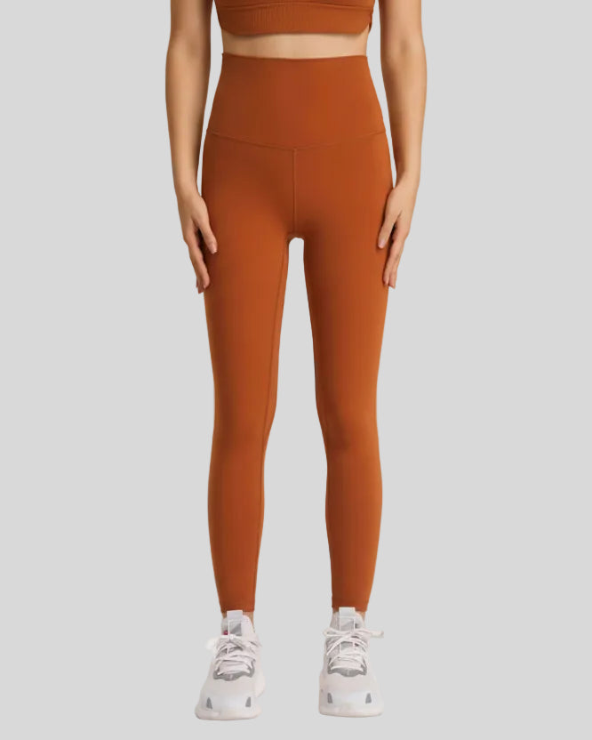 Front view of FlowLine Hold Soft Legging in brown with smooth high-waist fit