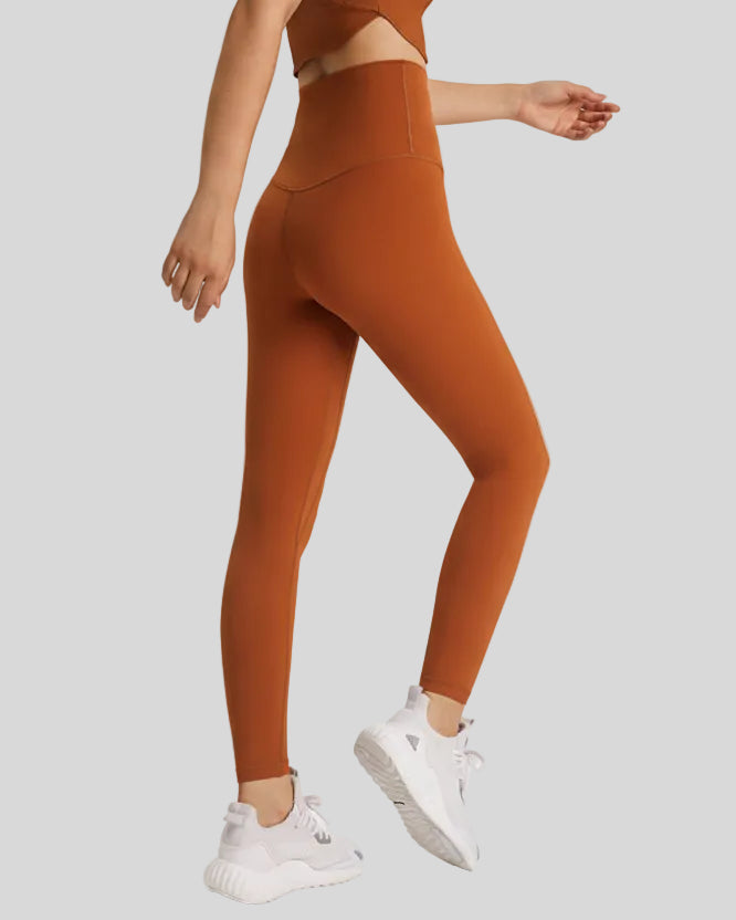 Back angle view of FlowLine Hold Soft Legging in brown highlighting smooth finish