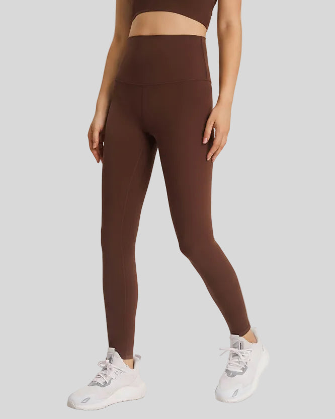 Front angle view of FlowLine Hold Soft Legging in coffee with fluid silhouette