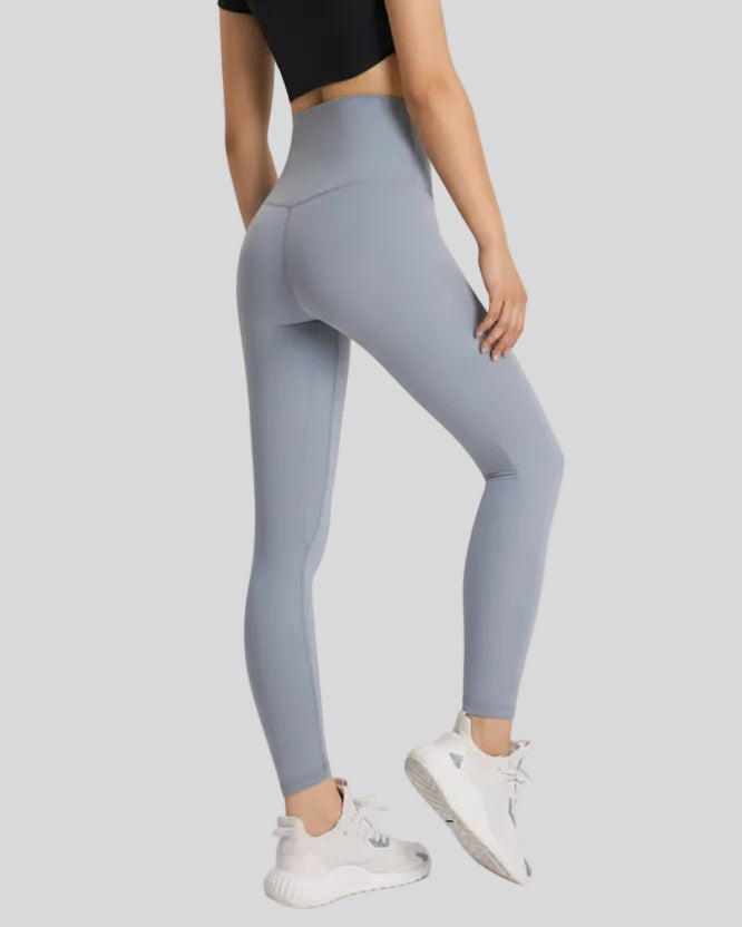 Back view of FlowLine Hold Soft Legging in gray with center stitching detail