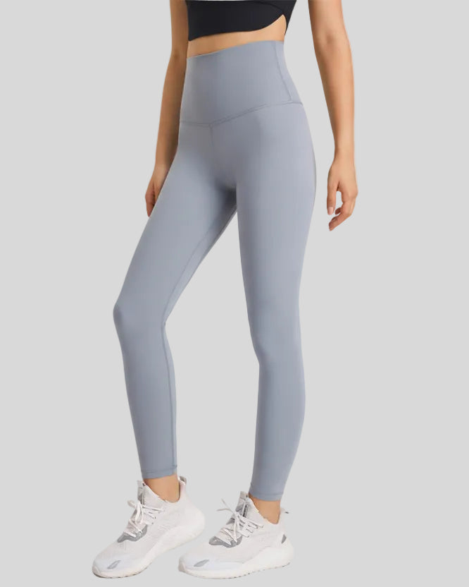 Front angle view of FlowLine Hold Soft Legging in gray with fluid silhouette