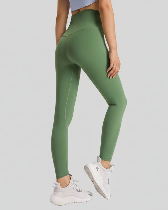Back angle view of FlowLine Hold Soft Legging in green highlighting smooth finish