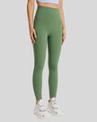 Front angle view of FlowLine Hold Soft Legging in green with fluid silhouette