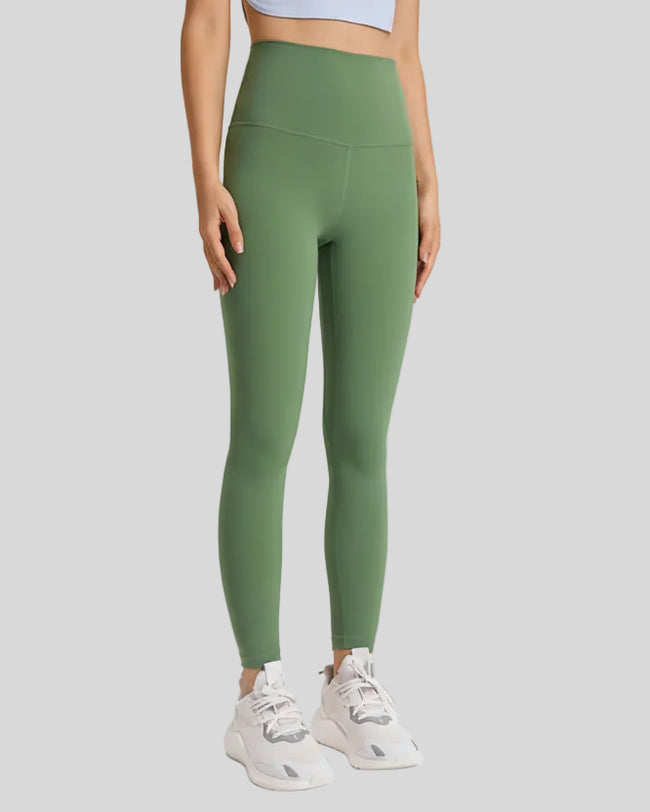 Front angle view of FlowLine Hold Soft Legging in green with fluid silhouette