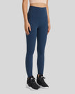 Front angle view of FlowLine Hold Soft Legging in navy with fluid silhouette