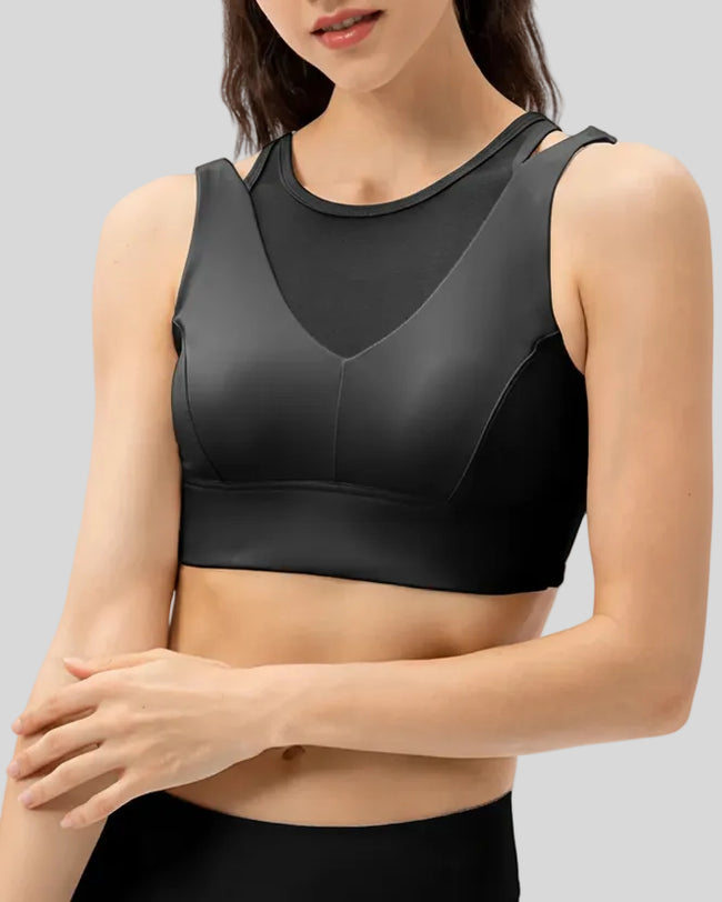 Sculpted sports bra with wide shoulder panels in Black, shown from the front