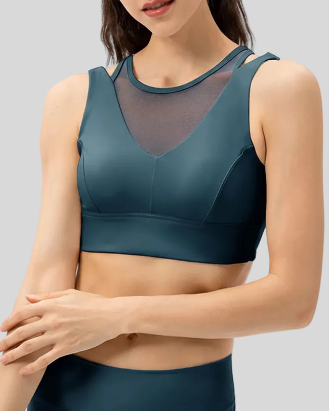 Sculpted sports bra with wide shoulder panels in Dark Blue, shown from the front