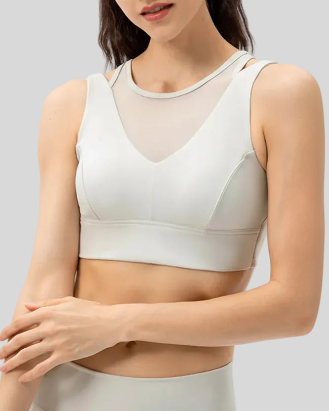 Sculpted sports bra with wide shoulder panels in White, shown from the front