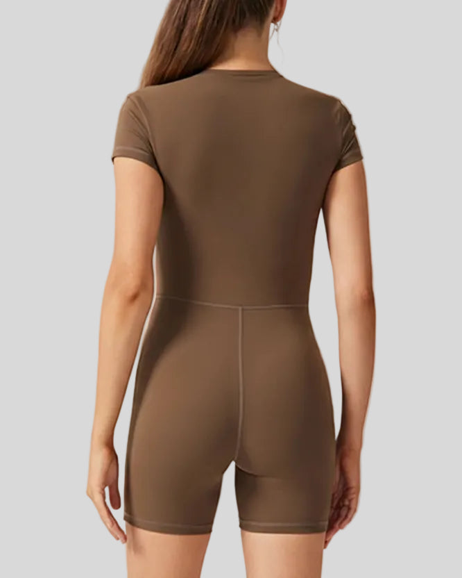 Back view of FlowZip short-sleeve romper in brown with clean, fitted silhouette