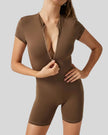 FlowZip short-sleeve romper in brown with half-zip front and streamlined fit