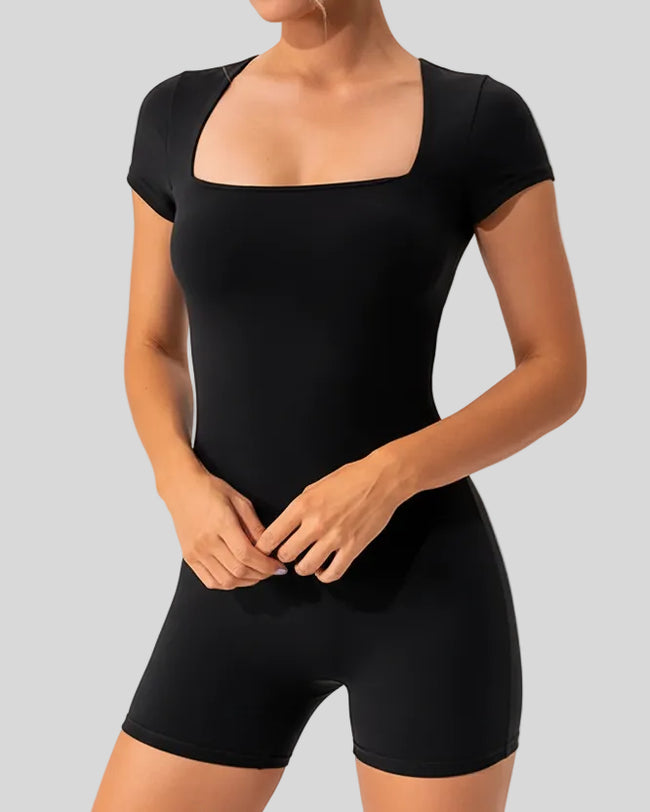 Angled front view of the FormAlign Square-Neck Romper showing sculpting fit in black