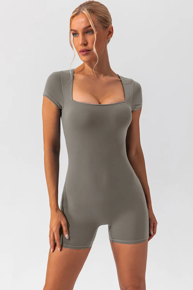 Angled front view of the FormAlign Square-Neck Romper showing sculpting fit in gray