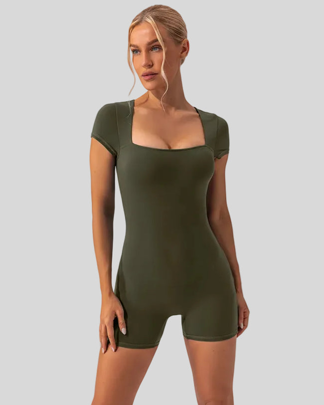 Angled front view of the FormAlign Square-Neck Romper showing sculpting fit in matcha green
