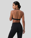 FormLine halter sports bra in black styled on model back view
