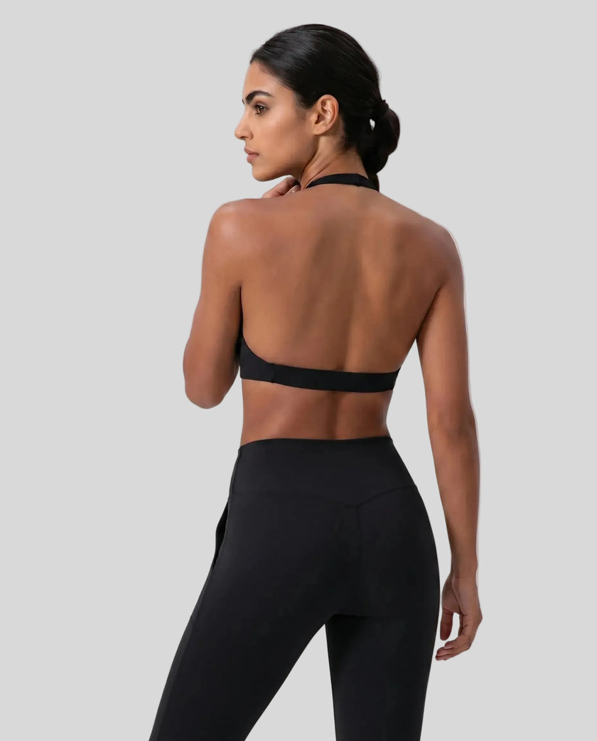 FormLine halter sports bra in black styled on model back view