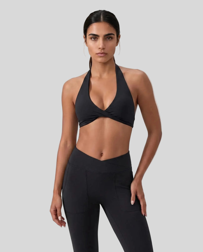 FormLine halter sports bra in black styled on model front view