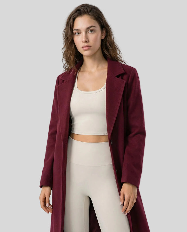 FormLine Trench in burgundy worn by model mid body front view highlighting fit and structure
