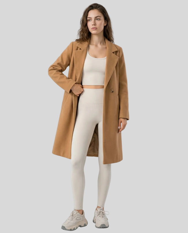 FormLine Trench in khaki worn by model full body front view styled in a modern neutral setting