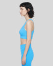 Side view of the FormLine Twist Sports Bra showing the supportive athletic fit