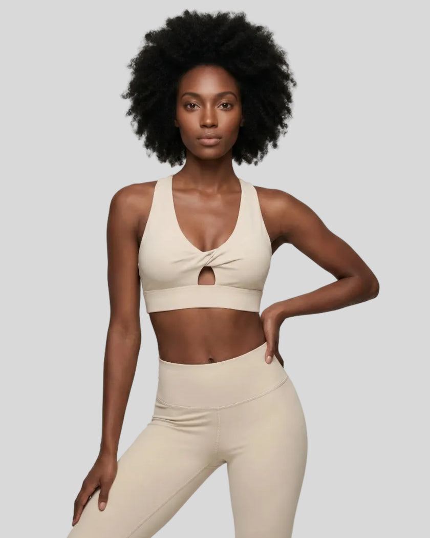 Model wearing the FormLine Twist Sports Bra in khaki front view