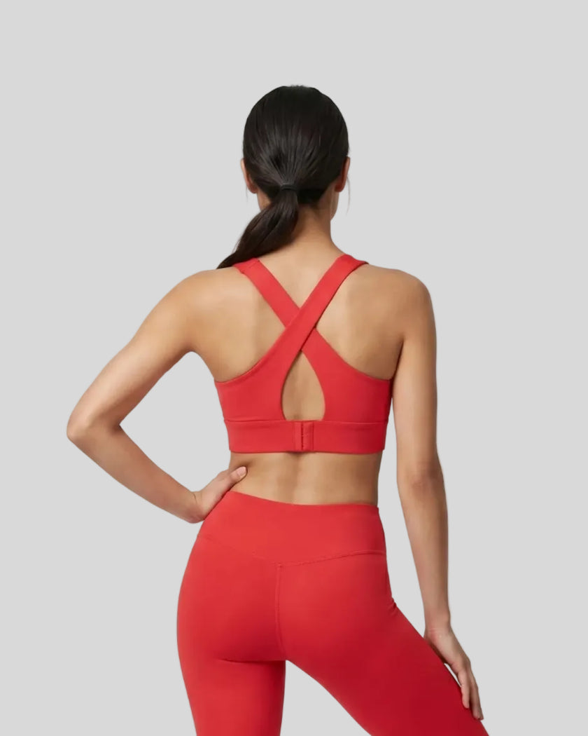 Back view of the FormLine Twist Sports Bra in red, highlighting the cross-back design