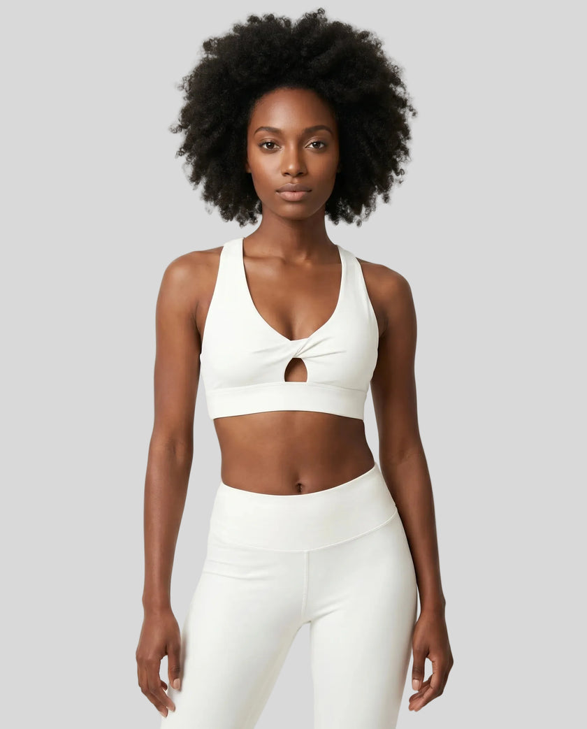 Model wearing the FormLine Twist Sports Bra in white front view