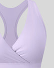 Close-up of FormLine wrap sports bra crossover V-neck detail