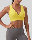 FormLine wrap sports bra in yellow, mid-body front view highlighting silhouette