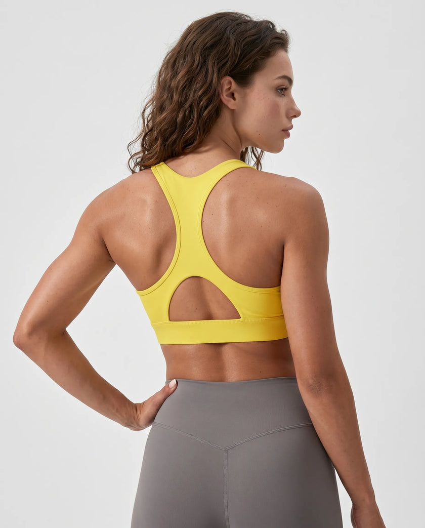 FormLine wrap sports bra in yellow styled on model back view