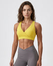 FormLine wrap sports bra in yellow styled on model front view