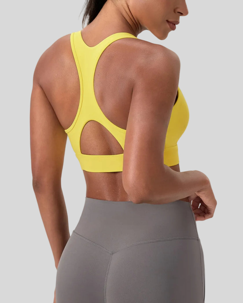 FormLine wrap sports bra in yellow, angled back view showing smooth support fit