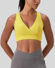 FormLine wrap sports bra in yellow, front view worn on upper body showing V-neck fit