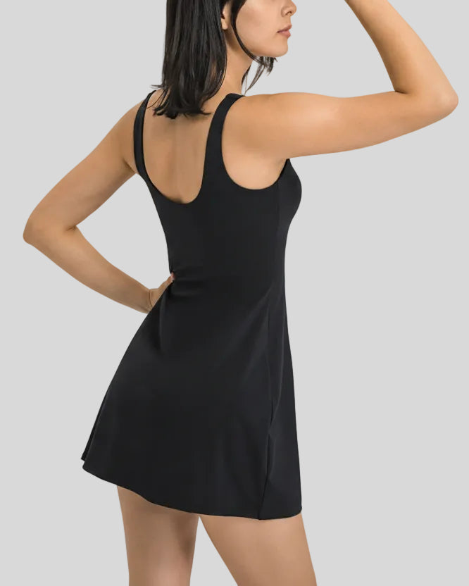 Back angled view of FormMove Active Dress in black showing lightweight performance fit