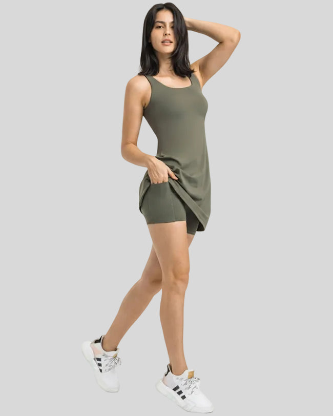 Side view of FormMove Active Dress in army green highlighting built-in shorts with pockets