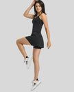 Side view of FormMove Active Dress in black highlighting built-in shorts with pockets