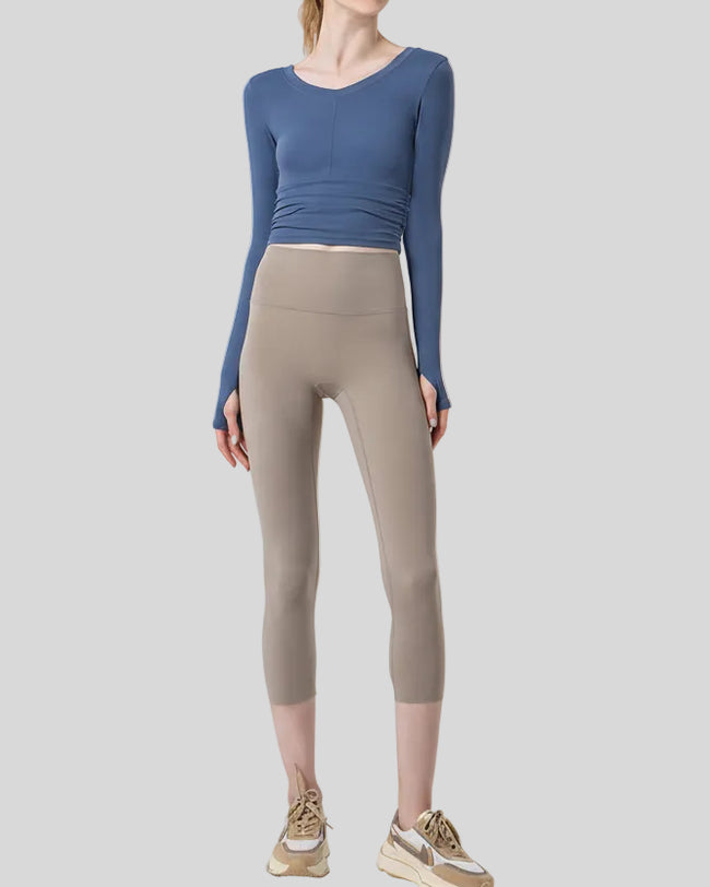 Front view of Athlesi GlowForm Sculpt Cropped Legging in beige