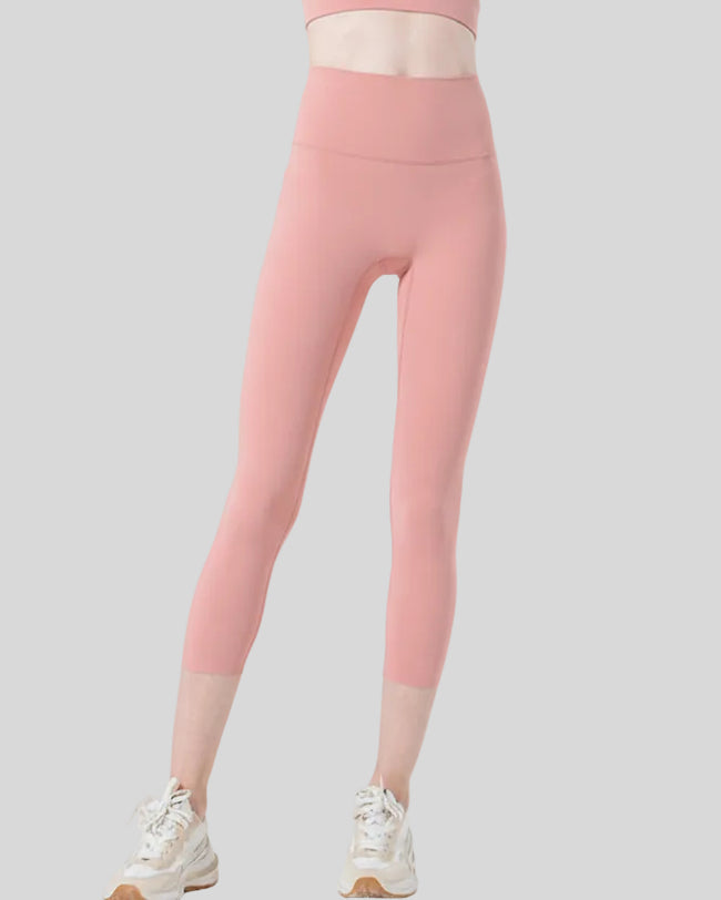 Front view of Athlesi GlowForm Sculpt Cropped Legging in coral