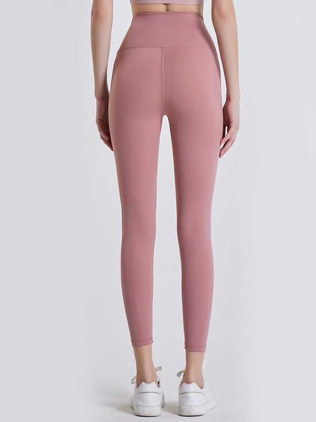 Back view of Athlesi GlowForm Sculpt legging in dusty pink