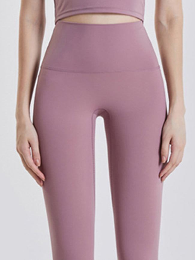 Close-up of Athlesi GlowForm Sculpt legging fabric and waistband detail in lilac