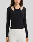 Front view of Athlesi HaloContour halter long sleeve top with ribbed fabric and fitted silhouette in black