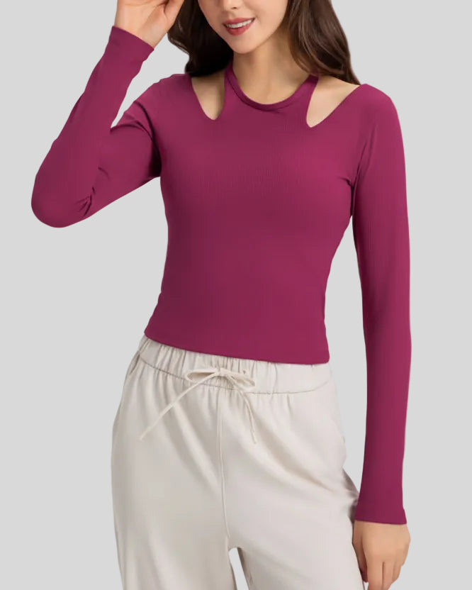 Angled front view highlighting halter neckline and ribbed texture of Athlesi HaloContour top in hot pink