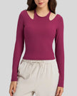 Front view of Athlesi HaloContour halter long sleeve top with ribbed fabric and fitted silhouette in hot pink