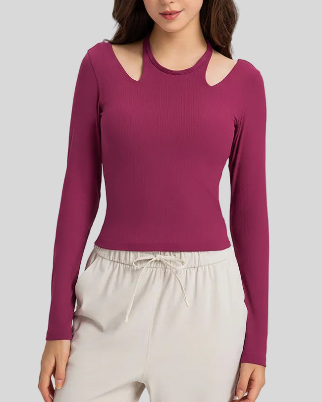 Front view of Athlesi HaloContour halter long sleeve top with ribbed fabric and fitted silhouette in hot pink