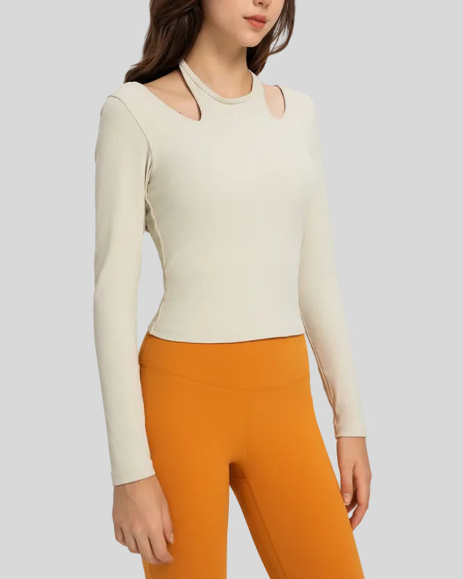 Angled front view highlighting halter neckline and ribbed texture of Athlesi HaloContour top in ivory