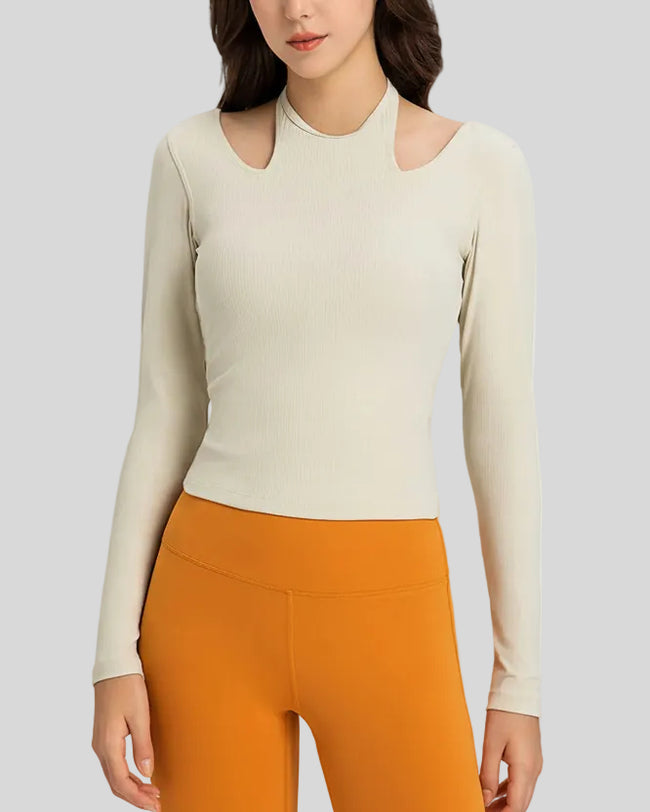 Front view of Athlesi HaloContour halter long sleeve top with ribbed fabric and fitted silhouette in ivory
