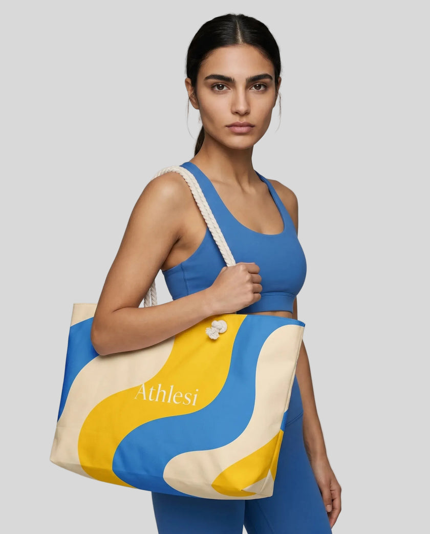 Model carrying oversized cerulean swirl tote bag