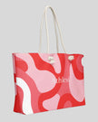Red swirl tote bag angled view rope handles