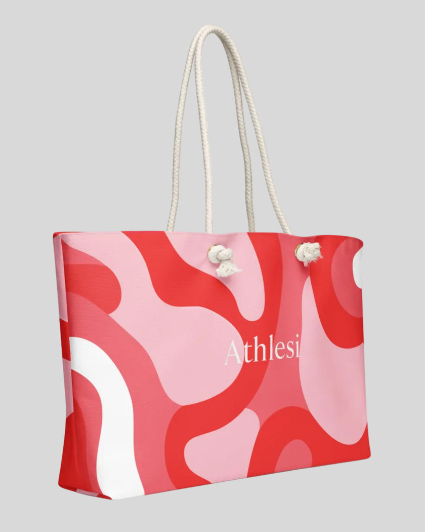Red swirl tote bag angled view rope handles
