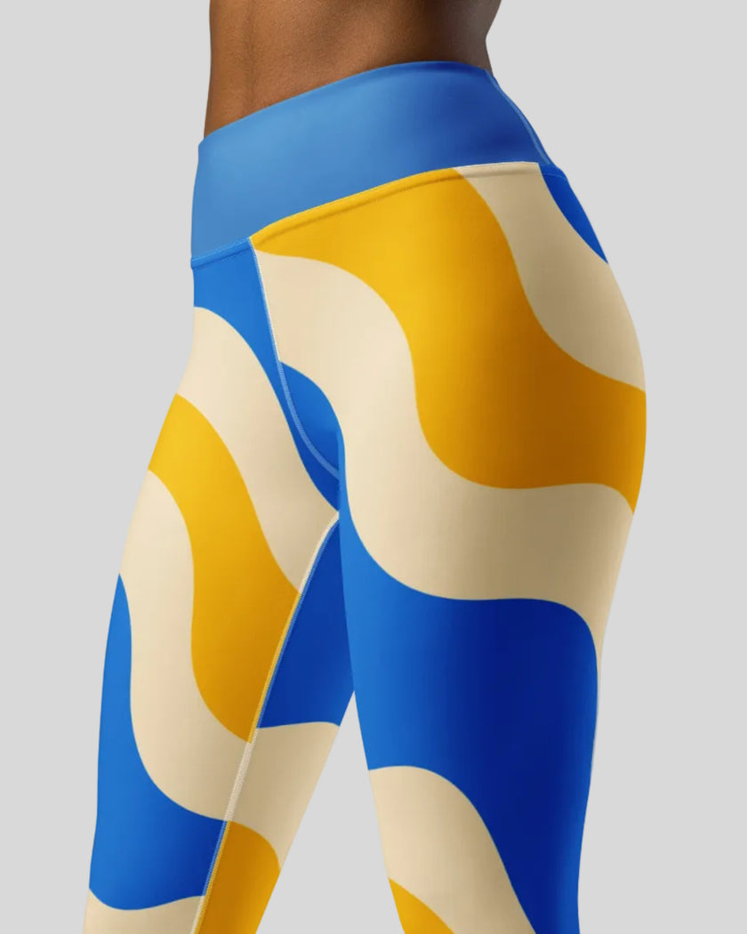 Mid body side view of cerulean swirl leggings 