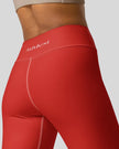 Fabric detail tomato red leggings back view
